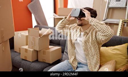 Young arab man using virtual reality glasses at new home Stock Photo