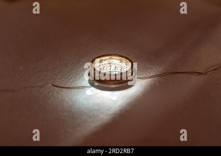 Two wedding rings illuminated backlight with beautiful bokeh, close-up ...