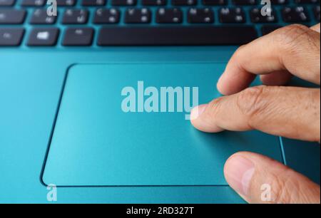 Closeup of fingers typing on a laptop Stock Photo