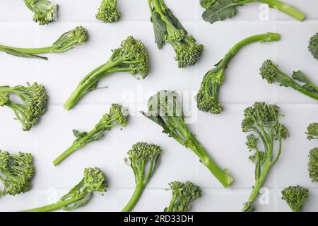 Fresh raw broccolini on white table, flat lay. Healthy food Stock Photo