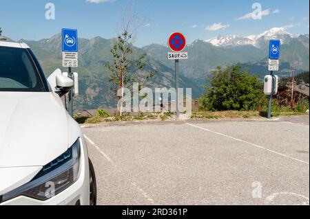 Les Arcs, France. 11th July, 2023. Reserved parking for electric cars, facing Mont Blanc, Les Arcs 1800, Le Chantel, France on July 11, 2023. Photo by Helder Januario/Abacapress Credit: Abaca Press/Alamy Live News Stock Photo