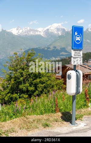 Les Arcs, France. 11th July, 2023. Reserved parking for electric cars, facing Mont Blanc, Les Arcs 1800, Le Chantel, France on July 11, 2023. Photo by Helder Januario/Abacapress Credit: Abaca Press/Alamy Live News Stock Photo