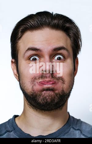 Bearded man explode with laughter portrait on white background Stock Photo