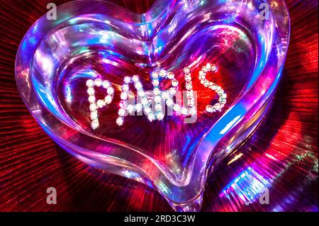 PARIS LOVE FUN NIGHT CONCEPT NIGHTCLUB NIGHTLIFE MONTMARTRE PIGALLE SHOWTIME CABARET CLUB diamonds crystal glass heart with mixed colour lighting in fun clubbing party theatre disco show French concept Paris France Stock Photo