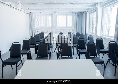 Clear conference room, classroom. White brick wall. Stock Photo