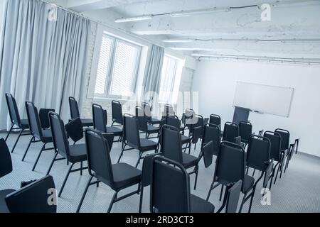 Clear conference room, classroom. White brick wall. Stock Photo