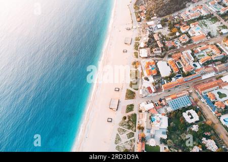Aerial rooftop cityscape view of a resort old town and blue sea with white sand beach Stock Photo