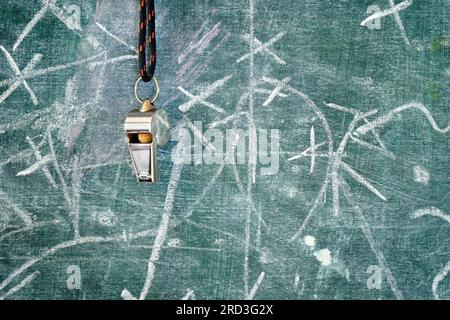 whistle of a soccer coach or referee and soccer tactics diagram on blackboard, great soccer event this year Stock Photo