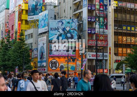 TOKYO, JAPAN - JULY 16 2023: Shoppers and tourists crowd the colorful Akihabara district in Tokyo, famous for its electronics shops Stock Photo