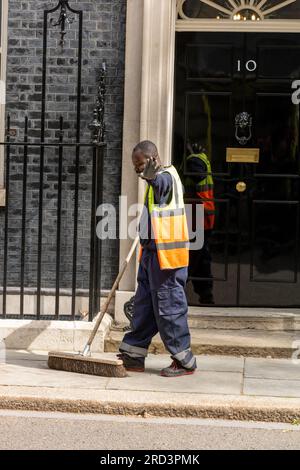 London, UK. 18th July, 2023. Street sweeper at 10 Downing Street London. Credit: Ian Davidson/Alamy Live News Stock Photo