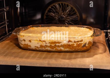 Dish Of Lasagne Cooking Inside Oven Stock Photo