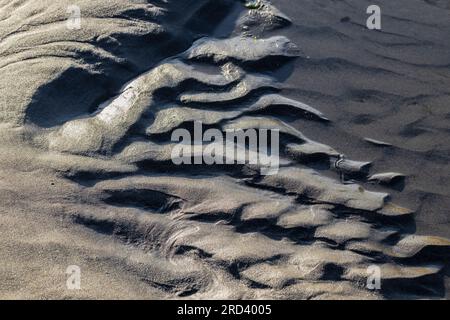 Dramatic patterns of wave-washed sand and stone on Shi Shi Beach, Olympic National Park, Washington State, USA Stock Photo