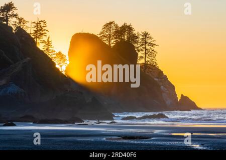 Sunset glowing on suspended sea spray and sea stacks at Point of Arches, Olympic National Park, Washington State, USA Stock Photo