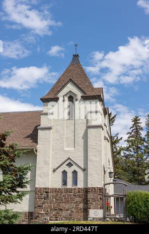 BANFF, CANADA - JULY 5, 2023: The historic Rundle Memorial United Church on the corner of Banff Avenue and Buffalo Street dates back to 1886, the firs Stock Photo