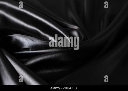 Background black twisted silk fabric,abstract texture satin fabric Stock Photo