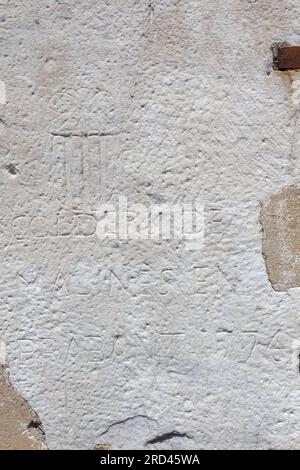 Ancient vandals in Rome - Visitors (1774) carving their names into the walls of Saint Sebastian Gate (Porta San Sebastiano or Porta Appia) - Rome Stock Photo