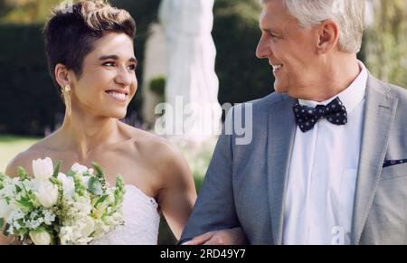 You deserve this happiness and much more. Cropped shot of an affectionate mature father smiling at his daughter while walking her down the while on Stock Photo