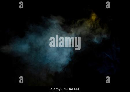 Blue and yellow steam on a black background. Copy space. Stock Photo