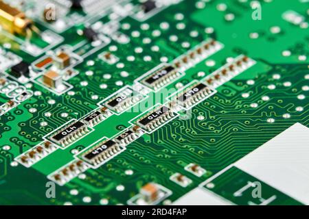 Resistors, capacitors, transistors on an electronic computer printed circuit board Stock Photo