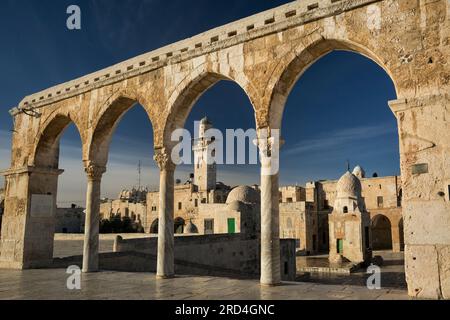 Horizontal slanted view of the Bab al-Silsila minaret through the gateway arches of the Temple Mount, Old City of Jerusalem, Israel Stock Photo