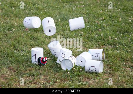 Tin can throwing Pyramid of tins stacked aluminum cans for throwing balls at them Stock Photo