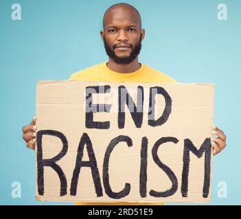 End racism poster, black man and protest isolated on blue background for social justice, change and equality problem. Youth, fight and cardboard sign Stock Photo