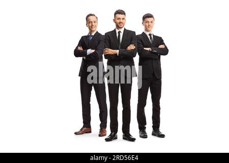 Three young businessmen in black suits posing isolated on white background Stock Photo