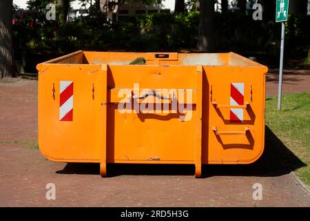 Orange skip with plant waste, waste container, Germany Stock Photo