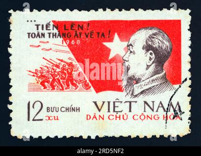 Ho Chi Minh (1890 – 1969). Postage stamp issued in Vietnam in 1968. Themes: New Year message, aviation, army. Stock Photo