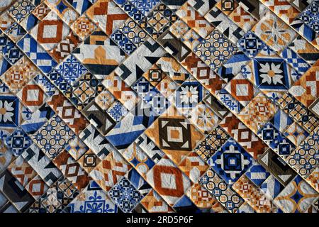 Detail of a traditional colorful tiled floor with repeating floral motifs forming beautiful ornamental patterns Stock Photo
