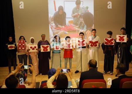 Cairo, Egypt. 18th July, 2023. Students show their paper cutting works at the closing ceremony of the first Chinese language summer camp in Cairo, Egypt, on July 18, 2023. More than 100 students from Egyptian governmental preparatory schools celebrated on Tuesday the conclusion of their first Chinese language summer camp. Credit: Ahmed Gomaa/Xinhua/Alamy Live News Stock Photo