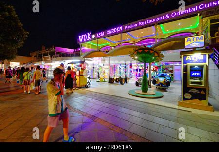 Lanzarote Canary Islands Puerto del Carmen recreation area with  bars shops and restaurants on the Ave Las Playas with clear dark   blue evening sky Stock Photo