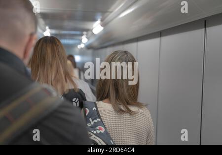 People walking in a gangway at airport in South Florida. Stock Photo