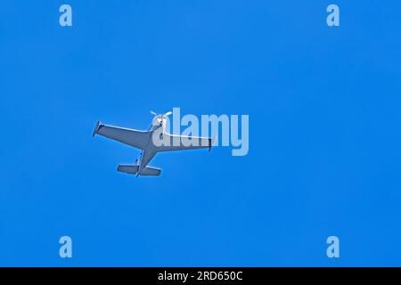 A single engine airplane flying overhead. Stock Photo
