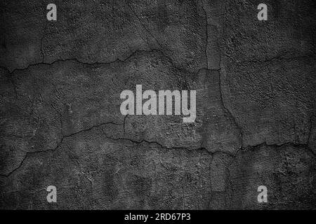 Cracked black concrete wall, gloomy cement texture background Stock Photo