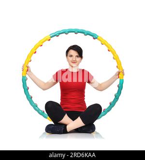 Beautiful woman sitting with color hula hoop Stock Photo