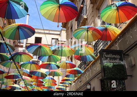 Colourful umbrellas over the Trattoria Colosseum restaurant, on Calea Victoriei, in Bucharest, Romania Stock Photo