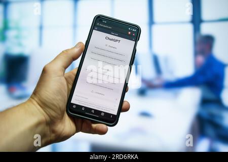 Man using Openai Chatgpt chatbot app at the office Stock Photo