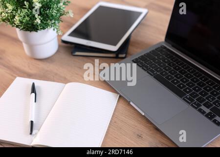 Wooden table with office supplies, top view Stock Photo