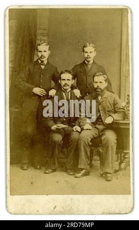 Reverse of Victorian CDV  group of four men,  friends with moustaches, from studio (carte de visite or visiting card)  of Geo (George) Berry, 445 Southwark Park Road, Bermondsey London directory..1880-86 . Stock Photo