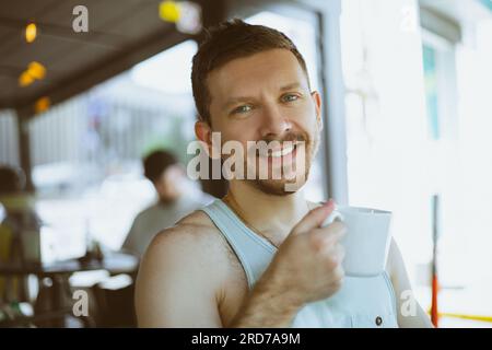 Happy man with a cup of coffee Stock Photo