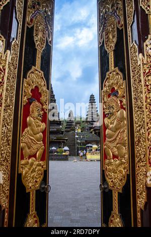 The view through the golden gates of the 'Pura Besikah' temple Stock Photo