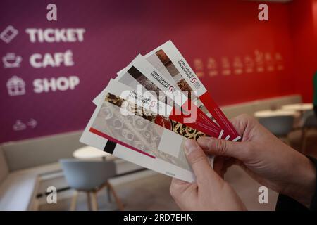 19 July 2023, Saxony-Anhalt, Halberstadt: A visitor holds tickets for the cathedral treasury in her hands. The new visitor center at the cathedral in Halberstadt is to be opened with a celebration at the end of August. On the north side of the building, guests will be welcomed in the future in a modern ambience, with store and café, announced the Cultural Foundation of Saxony-Anhalt on Wednesday. This will enhance the north portal as a new entrance to the cathedral and further strengthen the inseparable unity of the cathedral and the cathedral treasury, it said. The opening is scheduled for Au Stock Photo