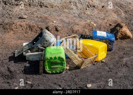 plastic rubbish washed up on a beach on the isle of wight polluting the environment. pollution caused by plastic rubbish on british beaches. Stock Photo