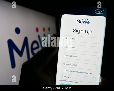 In this photo illustration a MeWe app seen displayed on a smartphone with  the MeWe logo in the background. (Photo by Thiago Prudencio / SOPA  Images/Sipa USA Stock Photo - Alamy