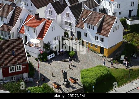 White painted houses in the Gamle area of Stavanger, Norway, including the statue of Vice Admiral Thore Horve. Stock Photo