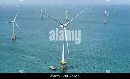 (230719) -- FUZHOU, July 19, 2023 (Xinhua) -- This aerial photo taken on July 19, 2023 shows a 16-megawatt wind turbine at the Fujian offshore wind farm operated by the China Three Gorges Corporation off the coast of southeast China's Fujian Province. The world's first 16-megawatt offshore wind turbine off the coast of Fujian Province was successfully connected to the grid and began generating electricity on Wednesday. The wind turbine has the largest single-unit generating capacity of all turbines in operation worldwide, the company said. The turbine's blades are each 123 meters long and Stock Photo