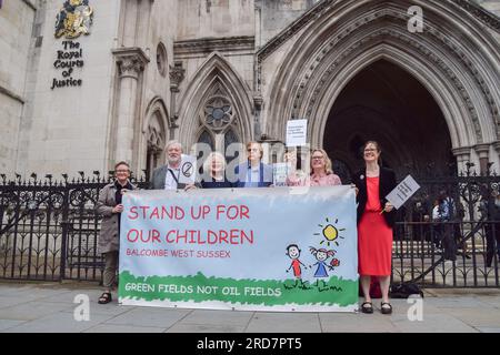 London, UK. 19th July 2023. Campaigners stand outside the Royal Courts of Justice as Frack Free Balcombe Residents Association begin their legal challenge against the government over oil testing in their village. Credit: Vuk Valcic/Alamy Live News Stock Photo
