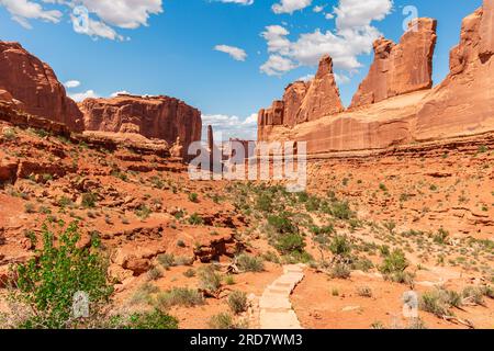 Park Avenue Trailhead in Arches National Park in Moab, Utah, United States. Massive Natural Sandstone Monuments Called Courthouse Towers Stock Photo