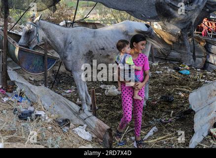 Gaza, Palestine. 18th July, 2023. Palestinian children play in front of the family home in the town of Beit Lahiya in the northern Gaza Strip. (Photo by Mahmoud Issa/SOPA Images/Sipa USA) Credit: Sipa USA/Alamy Live News Stock Photo